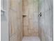 Shower stall featuring marble tile and updated fixtures at 3755 Greentree Dr, Decatur, GA 30032