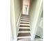 Staircase with wood steps and white risers and railings at 3755 Greentree Dr, Decatur, GA 30032