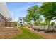 Backyard with a basketball court and wooden garden beds, perfect for sports and gardening enthusiasts at 417 E College Ave # 302, Decatur, GA 30030