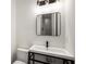 This bathroom features a corner sink with a metal frame and a modern, sleek faucet at 417 E College Ave # 302, Decatur, GA 30030