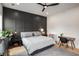This bedroom features a statement wall, neutral colors, and includes a desk for working from home at 417 E College Ave # 302, Decatur, GA 30030