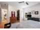 This bedroom features an open closet, natural light, and a hall leading to other rooms in the home at 417 E College Ave # 302, Decatur, GA 30030