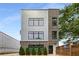 Modern exterior with brick and silver facade, complemented by well-placed windows and manicured greenery at 417 E College Ave # 302, Decatur, GA 30030