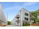 Modern exterior showcasing the architectural design, balconies, and landscaped frontage at 417 E College Ave # 302, Decatur, GA 30030