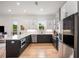 Well-equipped kitchen featuring stainless steel appliances, a spacious island, and modern cabinetry at 417 E College Ave # 302, Decatur, GA 30030