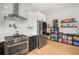 Stylish kitchen with stainless steel appliances, modern cabinets, and unique backsplash at 417 E College Ave # 302, Decatur, GA 30030