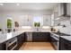 Well-equipped kitchen with stainless steel appliances, ample counter space, and sleek two-tone cabinetry at 417 E College Ave # 302, Decatur, GA 30030