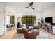 Bright living room featuring modern decor, hardwood floors, and expansive windows offering natural light at 417 E College Ave # 302, Decatur, GA 30030