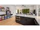 Open living area featuring a modern kitchen island, cozy seating, and unique decor at 417 E College Ave # 302, Decatur, GA 30030