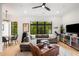 Inviting living room boasting stylish furnishings, large windows, and contemporary ceiling fan at 417 E College Ave # 302, Decatur, GA 30030