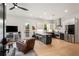 Open-concept living room with a modern kitchen, stainless steel appliances, and a cozy seating area at 417 E College Ave # 302, Decatur, GA 30030