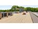 This stunning roof deck features a hammock, patio furniture, shade umbrella, and outdoor seating, perfect for entertaining at 417 E College Ave # 302, Decatur, GA 30030