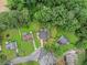 Aerial view showcases the homes with green space and tree-lined surroundings at 4835 Kellys Mill Nw Dr, Lilburn, GA 30047