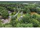 Scenic aerial shot of houses nestled among dense trees and green spaces at 4835 Kellys Mill Nw Dr, Lilburn, GA 30047
