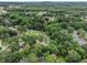 Aerial view showcases the tree-lined neighborhood and beautiful surroundings at 4835 Kellys Mill Nw Dr, Lilburn, GA 30047