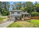 Charming two-story home with a welcoming front porch and nicely landscaped yard at 4835 Kellys Mill Nw Dr, Lilburn, GA 30047