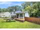 Charming home featuring a front porch, manicured lawn, and privacy fence at 4835 Kellys Mill Nw Dr, Lilburn, GA 30047