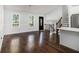 Spacious living room with ample natural light and wood flooring at 4835 Kellys Mill Nw Dr, Lilburn, GA 30047