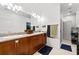 Bright bathroom with double sinks, granite counters, and a walk-in shower at 635 Holcomb Bridge Rd, Norcross, GA 30071