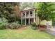 Charming home with a two-story porch and lush landscaping in a desirable neighborhood at 635 Holcomb Bridge Rd, Norcross, GA 30071
