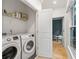 Convenient laundry room featuring modern appliances and a view to the backyard at 635 Holcomb Bridge Rd, Norcross, GA 30071