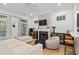 Bright living room featuring a fireplace, hardwood floors, and a comfortable seating area at 635 Holcomb Bridge Rd, Norcross, GA 30071