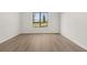 Bright bedroom with hardwood floors and large window, offering plenty of natural light at 1649 Tielman Way, Snellville, GA 30078