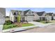 A beautifully designed home featuring a two-car garage, landscaped lawn, and a welcoming covered entryway at 1649 Tielman Way, Snellville, GA 30078