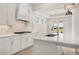 Spacious kitchen with a large island, stainless steel sink, and updated appliances at 1649 Tielman Way, Snellville, GA 30078