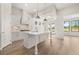 A bright kitchen with stainless steel appliances, a large island, and natural light at 1649 Tielman Way, Snellville, GA 30078