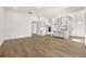 Expansive living area with hardwood flooring, connected to a modern kitchen with a center island at 1649 Tielman Way, Snellville, GA 30078