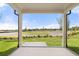 Covered patio overlooking landscaped backyard and neighborhood surroundings at 1649 Tielman Way, Snellville, GA 30078