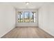 Bright room with three large windows offering scenic neighborhood views at 1649 Tielman Way, Snellville, GA 30078