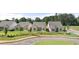 A street view showcases newly built homes with manicured lawns and harmonious architectural design at 1649 Tielman Way, Snellville, GA 30078