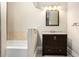 Bathroom with a dark wood vanity, stone tile accent, and modern fixtures at 1856 Austell Sw Cir, Marietta, GA 30060