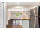 Open kitchen with a granite breakfast bar and modern stainless steel appliances at 1856 Austell Sw Cir, Marietta, GA 30060