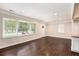 Bright living room featuring hardwood floors, large windows, and modern trim at 1856 Austell Sw Cir, Marietta, GA 30060