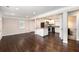 Open concept living area featuring hardwood floors, and granite countertops into the kitchen at 1856 Austell Sw Cir, Marietta, GA 30060