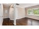 Living room with hardwood floors, white trim, and natural light at 1856 Austell Sw Cir, Marietta, GA 30060