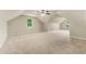 Expansive bonus room with vaulted ceilings, neutral carpet, and natural light at 3227 Ivy Lake Ct, Buford, GA 30519