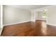 Elegant living room featuring beautiful hardwood floors, natural light, and neutral paint at 3227 Ivy Lake Ct, Buford, GA 30519