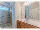 This bathroom has a glass shower, vanity and large mirror at 3404 Orchard St, Hapeville, GA 30354