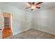 A bedroom with neutral walls, carpet and ceiling fan at 3404 Orchard St, Hapeville, GA 30354