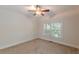 The bedroom has carpet flooring and a window offering natural light at 3404 Orchard St, Hapeville, GA 30354
