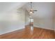 Spacious bedroom with hardwood floors, large ceiling fan, and a closet at 3404 Orchard St, Hapeville, GA 30354