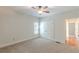 This is a comfortable bedroom with neutral walls, carpet and ceiling fan at 3404 Orchard St, Hapeville, GA 30354