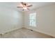 A bedroom with neutral walls, carpet and a window for natural light at 3404 Orchard St, Hapeville, GA 30354