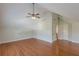 Spacious bedroom with hardwood floors, large ceiling fan, and a closet at 3404 Orchard St, Hapeville, GA 30354