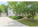 This is a charming home featuring a detached garage, beautiful landscaping, and a welcoming front porch at 3404 Orchard St, Hapeville, GA 30354