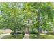 Charming home featuring a welcoming porch and mature trees in a picturesque setting at 3404 Orchard St, Hapeville, GA 30354